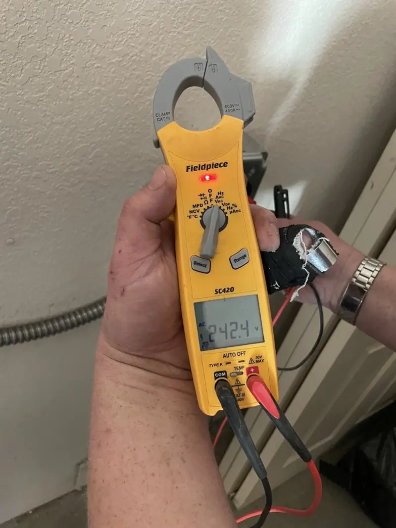 Voltage testing with clamp meter during Electrical Installation Services in Deptford